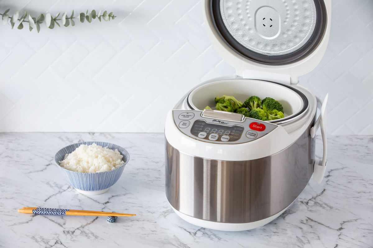 A bowl of perfectly cooked rice and broccoli steaming in the Healthy Choice 5L Electric Rice Cooker.