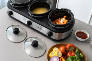 Top view of the 3-Pot Slow Cooker with soup and vegetables cooking.