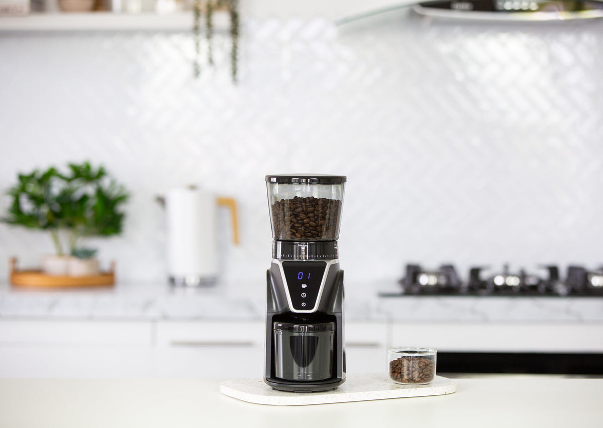 CG112 electric coffee bean grinder in a modern kitchen