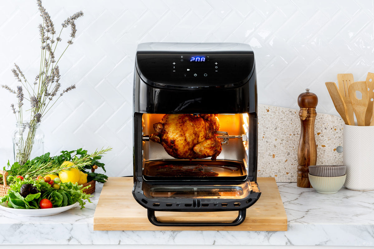 12L Digital Air Fryer Oven with the door open and a whole chicken on rotisserie.