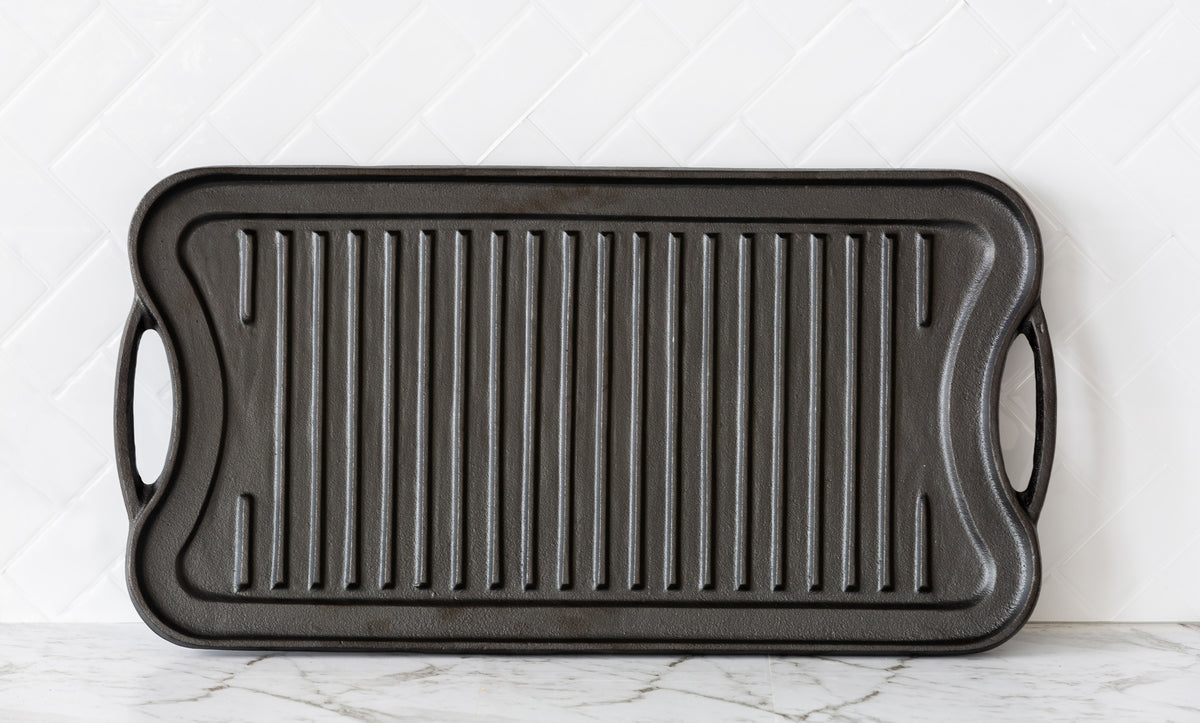 Seasoned Cast Iron reversible Grill/Griddle in a kitchen.