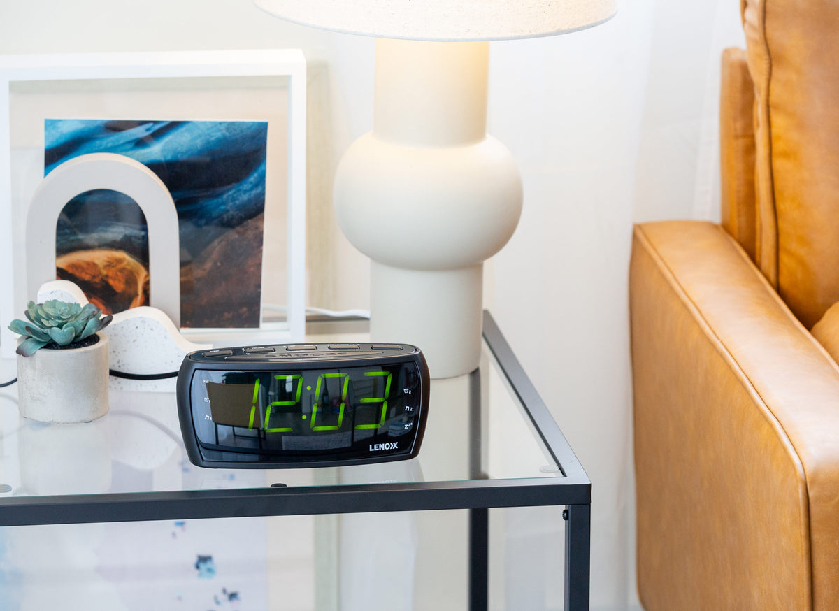 Large Number Alarm Clock with AM/FM Radio in a living room setting.