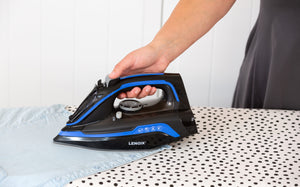 Cordless Steam Iron being used in a laundry room.