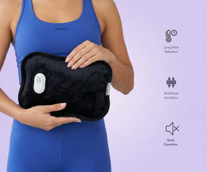 Woman holding the Lenoxx HWB70 Rechargeable Electric Hot Water Bottle.