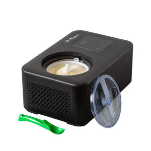 Black ice cream maker with a scoop and see through lid on a white background
