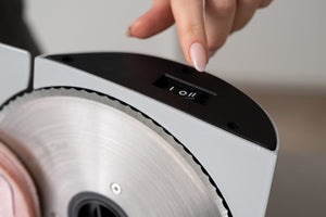 detail of the power button of the Premium Electric Food Slicer.
