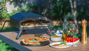 Healthy Choice 13" Gas Pizza Oven in a backyard setting.