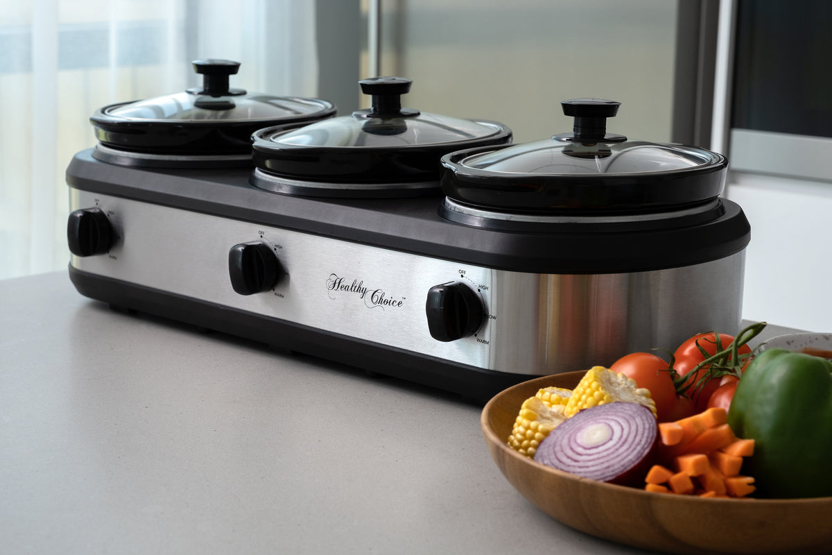 3-Pot Slow Cooker in a modern kitchen with a bowl of fresh vegetables next to it.