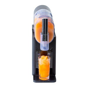 Orange juice slushie extracted into a tall glass on a white background