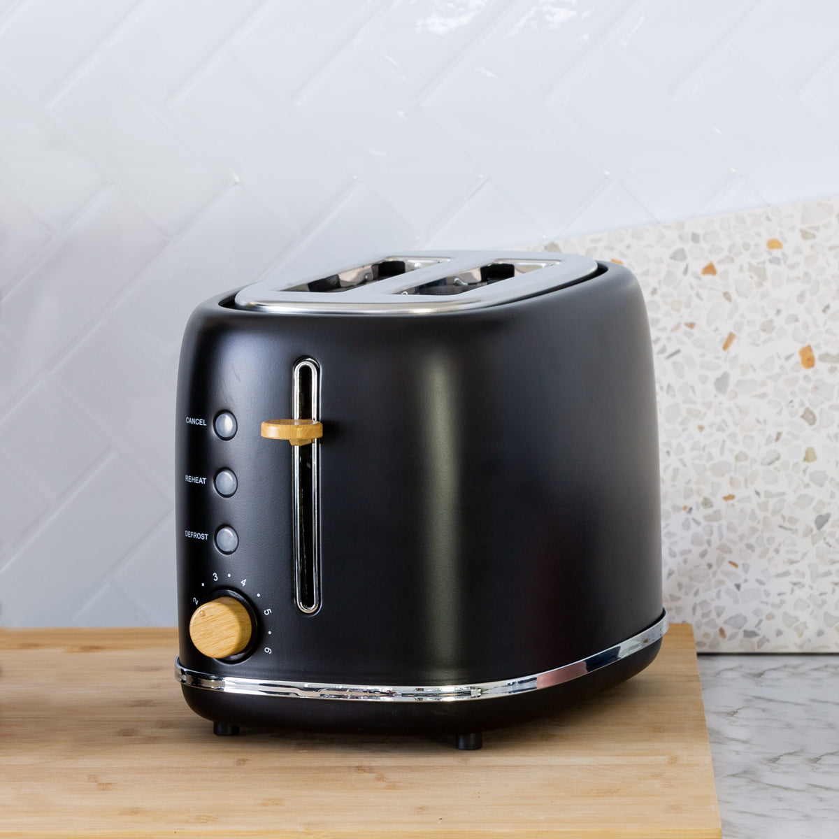 2-Slice Bread Toaster in Black with Wood Accents in a modern kitchen