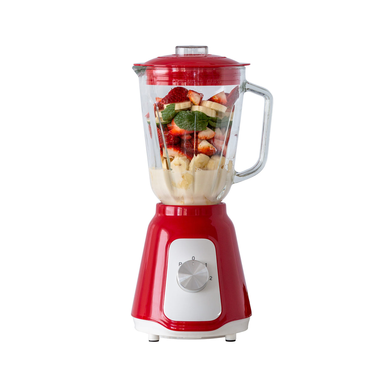 Red table blender filled with fruit ready to make a perfect smoothie.