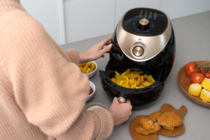 A top view of the AF350 3.5L Air Fryer with the cooking basket open and full of fries.