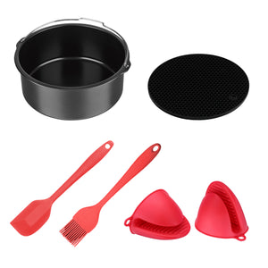 Baking accessories set for an air fryer: cake tin and silicon mat as well as red silicon spatula, brush and mitts.