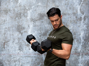 RBD10 10kg Dumbbell held by a muscular man