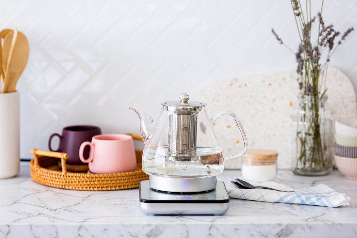 SK200 glass kettle on a marble bench in a modern bright kitchen.