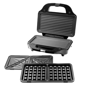 Open Sandwich Press with the grill plates installed and other two types of the interchangeable plates next to it.